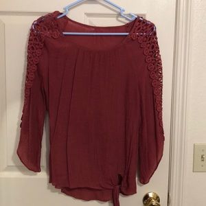 Rust colored top with gorgeous detail on sleeps